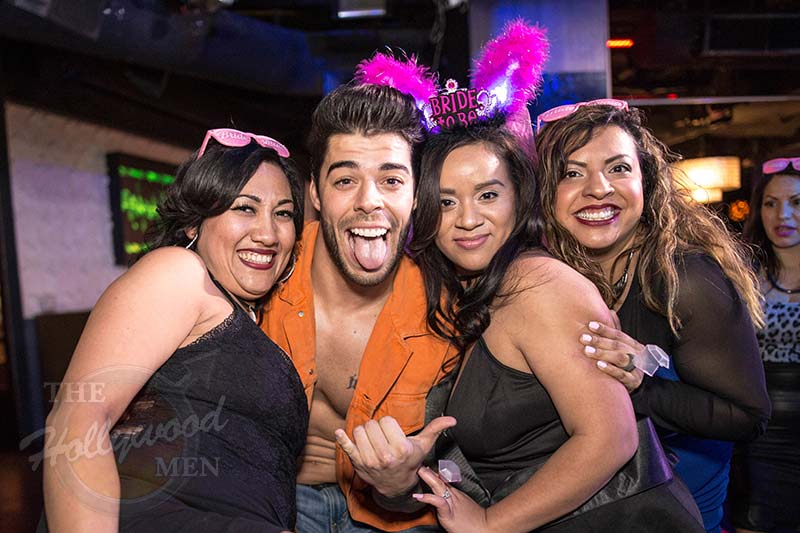 Victor poses with 3 ladies at The Hollywood Men