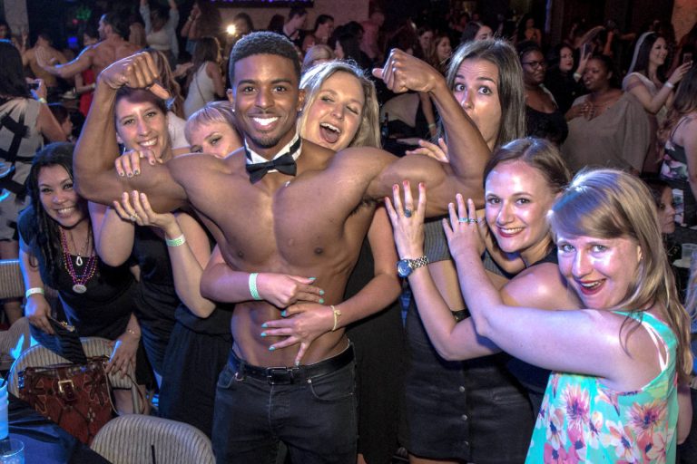 topless waiters serving ladies at the Hollywood Men show