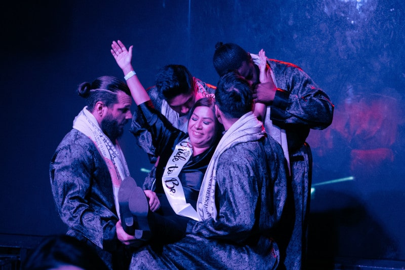 addicted strip act by the hollywood men on stage wearing robes