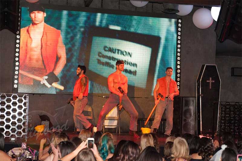construction worker strippers on stage