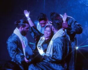 lady participating in the act - addicted male strip act