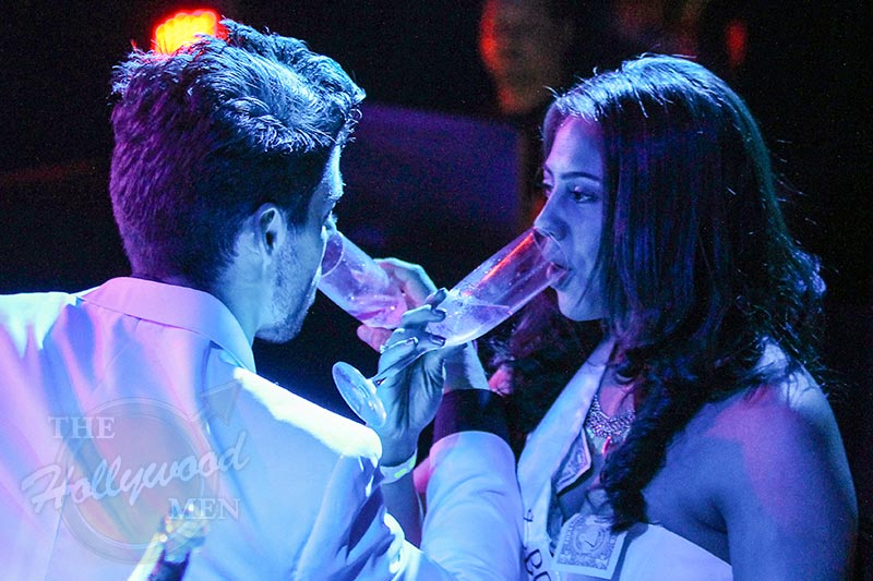 victor sips champagne with lady on stage as her latin lover