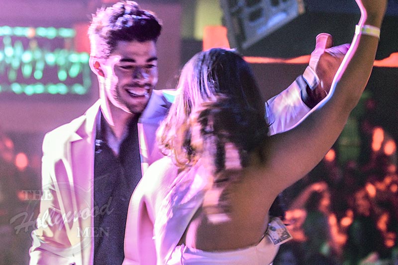 victor dances with lady on stage as her latin lover