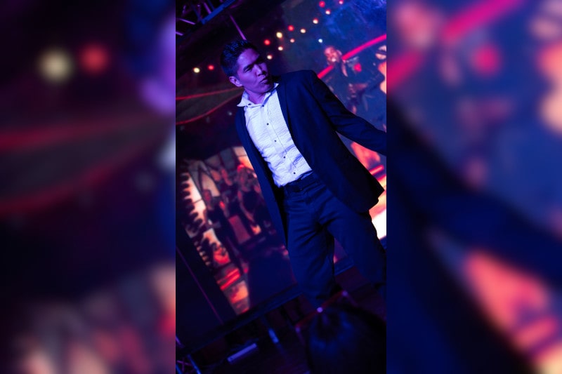 cesar dances on stage during man's world strip act